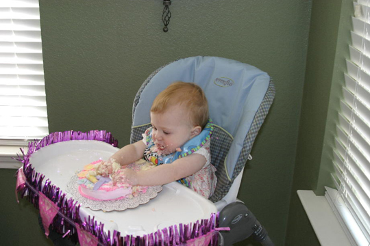 Digging into her own cake